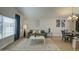 Bright living and dining area featuring neutral tones, comfortable seating, stylish accents, and an elegant chandelier at 5618 W Blackhawk Dr, Glendale, AZ 85308