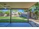 Covered patio overlooking the lush, well-maintained backyard at 5618 W Blackhawk Dr, Glendale, AZ 85308