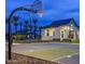 Outdoor basketball court with lighting and community building, perfect for sports and social activities at 5812 E Sanford St, Mesa, AZ 85215