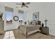 Cozy bedroom with a scenic view from two bright windows and warm wood flooring at 5812 E Sanford St, Mesa, AZ 85215