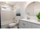 Bright bathroom featuring a new vanity, modern fixtures, and a shower-over-tub combination at 624 E Laguna Dr, Tempe, AZ 85282