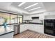Bright kitchen with white cabinets, stainless steel appliances, and backyard views at 624 E Laguna Dr, Tempe, AZ 85282