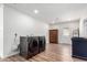 Spacious laundry room with modern washer and dryer and wood-look floors at 624 E Laguna Dr, Tempe, AZ 85282