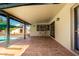 Covered patio with access to the pool, bar seating, and an outdoor living space at 624 E Laguna Dr, Tempe, AZ 85282