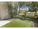 Inviting backyard featuring lush green turf and mature trees providing ample shade at 7705 E Doubletree Ranch Rd # 21, Scottsdale, AZ 85258