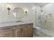 Stylish bathroom with walk-in shower, modern lighting, and a wood-grain vanity at 7705 E Doubletree Ranch Rd # 21, Scottsdale, AZ 85258