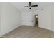 This bedroom features light hardwood floors, a ceiling fan, and a closet with sliding doors at 7705 E Doubletree Ranch Rd # 21, Scottsdale, AZ 85258