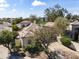 Beautiful home exterior with a well-manicured yard, mature trees, and a private driveway at 7705 E Doubletree Ranch Rd # 21, Scottsdale, AZ 85258