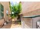 Backyard featuring a storage shed, neutral block wall and landscaping at 10414 W Windsor Ave, Avondale, AZ 85392