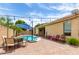 Charming backyard with a refreshing pool, outdoor dining, and ample patio space at 10414 W Windsor Ave, Avondale, AZ 85392