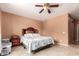 Comfortable bedroom featuring neutral walls, tile floors, and a ceiling fan at 10414 W Windsor Ave, Avondale, AZ 85392