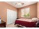 Cozy bedroom with neutral tones and a large closet for ample storage at 10414 W Windsor Ave, Avondale, AZ 85392