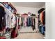Walk-in closet with ample storage shelves and clothing racks for organization at 10414 W Windsor Ave, Avondale, AZ 85392