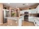 Spacious kitchen featuring stainless steel appliances, granite counters, and a center island at 10414 W Windsor Ave, Avondale, AZ 85392