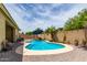 Inviting backyard pool area with lush landscaping, perfect for outdoor entertaining at 10414 W Windsor Ave, Avondale, AZ 85392