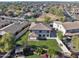 Aerial view showcasing the property's spacious backyard, well-maintained landscaping, and surrounding neighborhood at 1093 E Doral Ave, Gilbert, AZ 85297