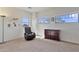 Cozy bedroom featuring natural light, carpet, a dresser, and comfortable seating, perfect for relaxation at 1093 E Doral Ave, Gilbert, AZ 85297