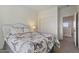 Bedroom featuring a decorative bed and nightstand with a bright window and access to closet at 1093 E Doral Ave, Gilbert, AZ 85297