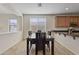 Dining room area with seating for six and decorative lighting at 1093 E Doral Ave, Gilbert, AZ 85297