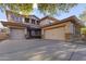 Stunning two-story home with a three-car garage and stone accents, offering curb appeal and ample parking space at 1093 E Doral Ave, Gilbert, AZ 85297