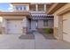 Welcoming home with covered front entrance, three-car garage, and desert landscaping at 1093 E Doral Ave, Gilbert, AZ 85297