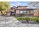 Charming two-story home featuring a landscaped front yard, stone accents, and a spacious driveway leading to the garage at 1093 E Doral Ave, Gilbert, AZ 85297