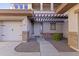 Welcoming home with covered front entrance, three-car garage, and desert landscaping at 1093 E Doral Ave, Gilbert, AZ 85297