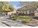 Inviting home with lush lawn, beautiful landscaping and a three-car garage at 1093 E Doral Ave, Gilbert, AZ 85297