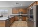 Well-appointed kitchen featuring stainless steel appliances and beautiful cabinetry providing a functional and stylish space at 1093 E Doral Ave, Gilbert, AZ 85297