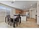Bright kitchen and dining area featuring stainless steel appliances and a cozy dining table with seating for six at 1093 E Doral Ave, Gilbert, AZ 85297