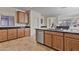 Well-equipped kitchen with stainless steel appliances and dark granite counters at 1093 E Doral Ave, Gilbert, AZ 85297