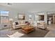Cozy living room with ample natural light, comfortable seating, and views into the kitchen at 1093 E Doral Ave, Gilbert, AZ 85297