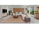 Spacious living room features large windows, a comfy sectional sofa, and decorative shelving at 1093 E Doral Ave, Gilbert, AZ 85297