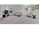 Bright living room with neutral carpet, white walls, and modern decor at 1093 E Doral Ave, Gilbert, AZ 85297