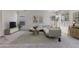 Bright living room featuring a neutral color palette, modern furniture, and ample natural light at 1093 E Doral Ave, Gilbert, AZ 85297
