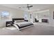 Serene main bedroom with sitting area, a ceiling fan, and neutral décor creating a relaxing retreat at 1093 E Doral Ave, Gilbert, AZ 85297
