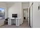 Bright office space with carpeted floors and a white desk is naturally lit by a window at 1093 E Doral Ave, Gilbert, AZ 85297