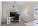 Bright office space with carpeted floors and a white desk and chair positioned near a window at 1093 E Doral Ave, Gilbert, AZ 85297