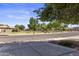 A serene street view showcasing nearby green spaces and well-maintained lawns at 1093 E Doral Ave, Gilbert, AZ 85297