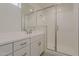 Modern bathroom featuring a stylish vanity, framed mirror, and a glass-enclosed shower at 11300 N Casa Dega Dr # 1044, Surprise, AZ 85388