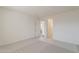 Bedroom with neutral carpet, white paint, and doorways showing the layout and flow of the space at 11300 N Casa Dega Dr # 1044, Surprise, AZ 85388