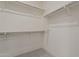 Well-organized closet features multiple shelves and rods, maximizing storage space for a tidy and efficient wardrobe at 11300 N Casa Dega Dr # 1044, Surprise, AZ 85388