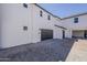 Exterior view of a modern home showing garage with paver driveway at 11300 N Casa Dega Dr # 1044, Surprise, AZ 85388