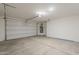 Spacious garage with overhead door and water heater at 11300 N Casa Dega Dr # 1044, Surprise, AZ 85388