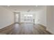 Upstairs living area featuring an exit to balcony, white walls, and hardwood floors at 11300 N Casa Dega Dr # 1044, Surprise, AZ 85388