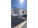 Charming manufactured home with covered porch, steps and birdbath at 11596 W Sierra Dawn Blvd # 64, Surprise, AZ 85374