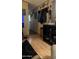Neutral hallway featuring a coat rack, and view into a connected living area at 11596 W Sierra Dawn Blvd # 64, Surprise, AZ 85374