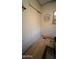 Hallway with bi-fold closet doors, neutral walls, and laminate flooring at 11596 W Sierra Dawn Blvd # 64, Surprise, AZ 85374