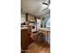 Bright kitchen area with wooden cabinets, and dining area with round table at 11596 W Sierra Dawn Blvd # 64, Surprise, AZ 85374
