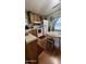 Charming kitchen featuring wood cabinets, updated appliances, and an adjacent breakfast nook at 11596 W Sierra Dawn Blvd # 64, Surprise, AZ 85374
